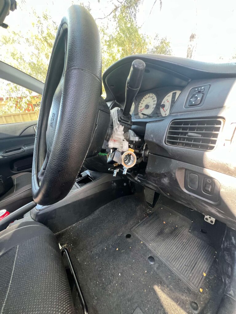 Mitsubishi steering column stripped back to expose the ignition lock assembly
